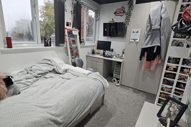 A Cozy Bedroom Featuring A Double Bed, A Large Win...