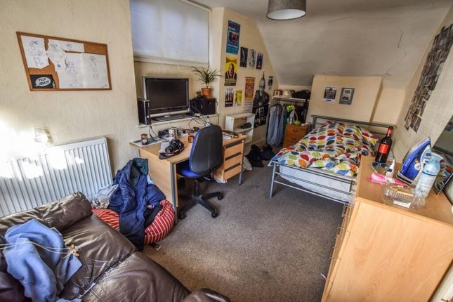 A Spacious And Cozy Bedroom Featuring A Comfortabl...