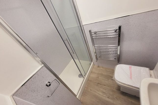 This Modern Bathroom Features A Sleek Shower Enclo...