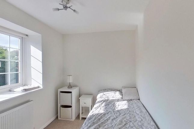 A Bright And Clean Small Bedroom Featuring A Singl...