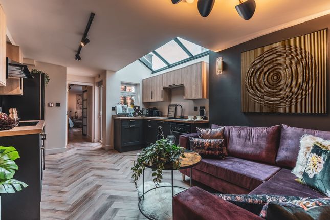 Stylish Open-Plan Living Area With A Plush Purple ...