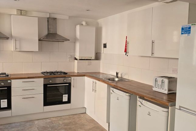 Bright, Modern Kitchen With Matching White Cabinet...