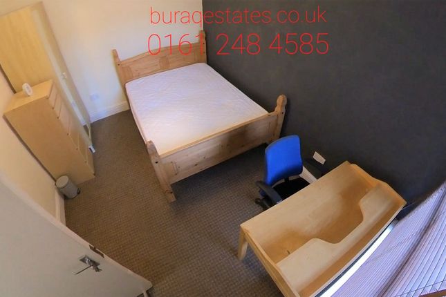 A Clean And Neat Single Bedroom Featuring A Wooden...