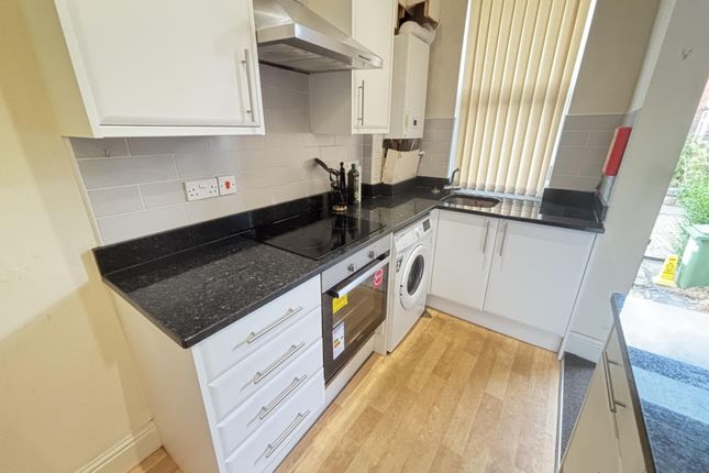 Bright And Clean Kitchen Area With Modern Applianc...