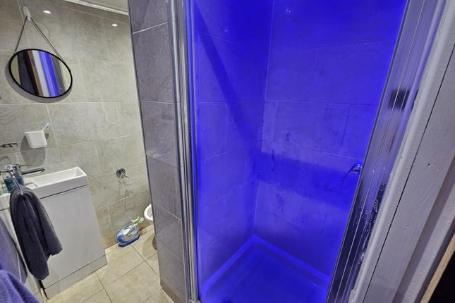 Modern Bathroom Featuring A Spacious Shower Enclos...