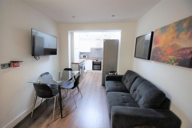 A Modern And Inviting Living Room Featuring A Comf...