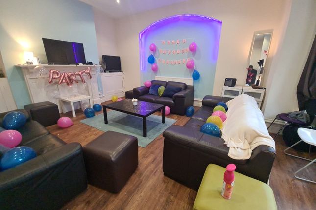 Bright And Inviting Living Room Featuring Comforta...