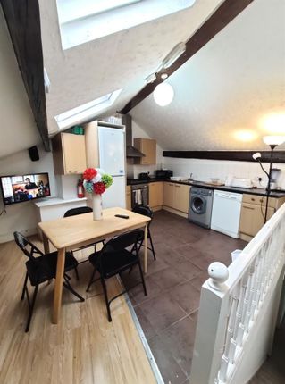 Bright And Modern Kitchen Area With Sloped Ceiling...
