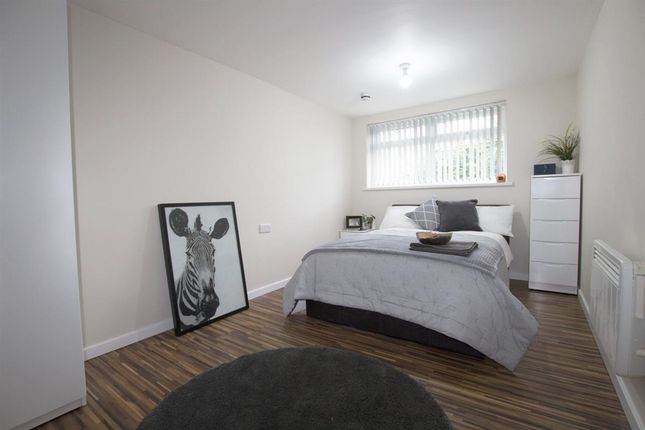 A Bright And Modern Double Bedroom Featuring A Lar...