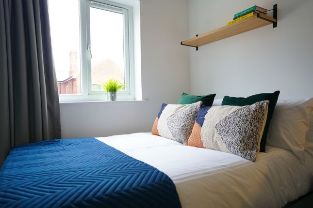 A Bright And Inviting Double Bedroom Featuring Sty...