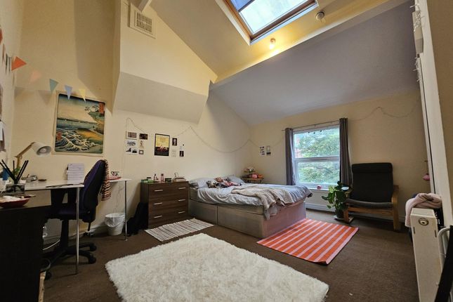 Spacious Master Bedroom Featuring A Large Bed, A S...