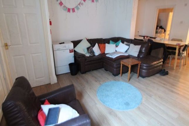 A Spacious And Inviting Living Room Featuring Comf...