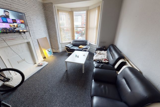 A Bright And Welcoming Living Room With A Modern B...