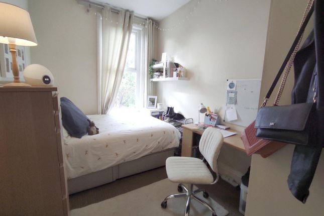 Bright, Neatly Arranged Bedroom With A Comfortable...