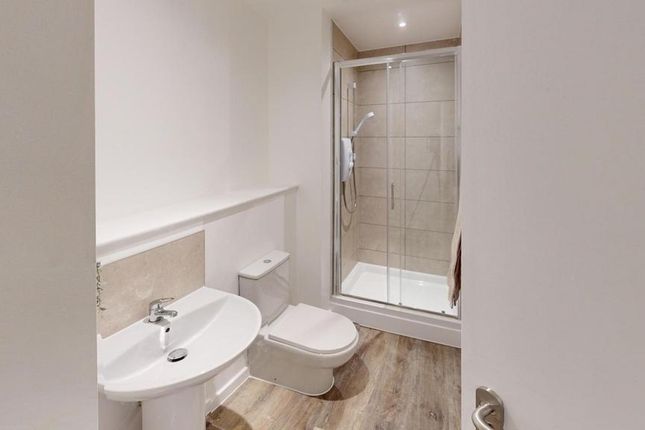 A Modern And Clean Bathroom Featuring A Spacious S...