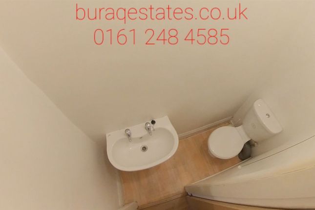 A Compact And Clean Single Toilet Room With A Whit...