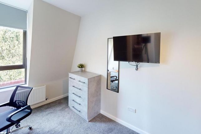 A Bright And Modern Double Bedroom Featuring A Sty...
