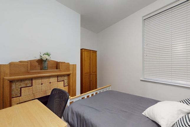 A Bright And Tidy Double Bedroom Featuring A Styli...