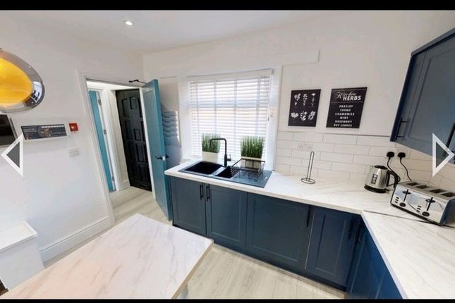 Bright And Modern Kitchen Featuring Stylish Blue c...