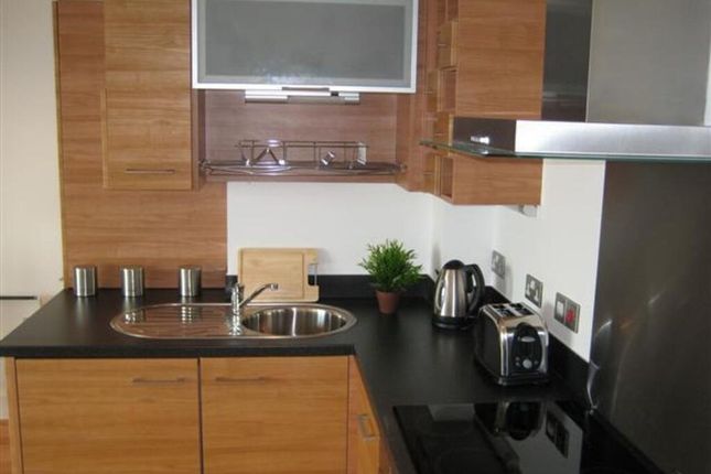 A Modern Kitchen Featuring Sleek Wooden Cabinetry,...
