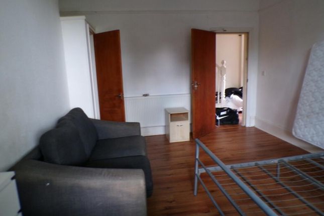 Spacious Double Bedroom Featuring A Cozy Sofa, Amp...