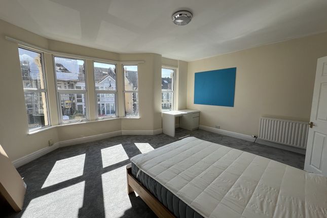 Bright And Spacious Master Bedroom With A Large Ba...