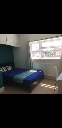 This Inviting Double Bedroom Features A Comfortabl...