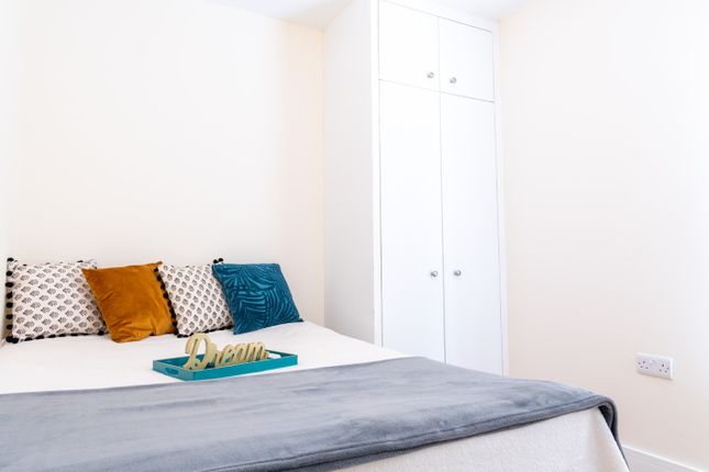 Cozy Double Bedroom Featuring A Comfortable Bed Wi...