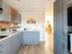 The Bright And Airy Kitchen Is At The Front Of The Home