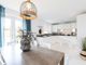 The Open-Plan Kitchen/Dining Area Features Double Doors Out To The Garden