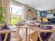 The Dining Space Enjoys Views Of The Garden Through French Doors