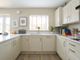 A Light And Airy Kitchen, With Views Of The Garden