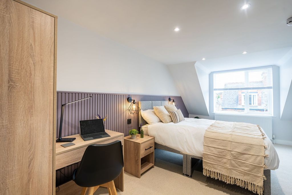 Property photo 2 of 14 A Bright And Stylish Master Bedroom Featuring A Co...