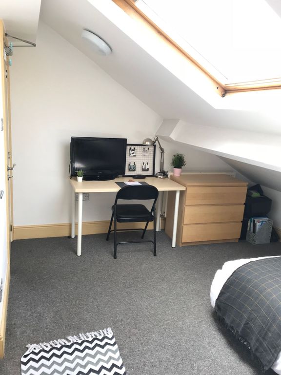 Property photo 2 of 14 This Cozy Double Bedroom Features Ample Natural li...