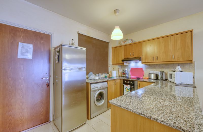 Property photo 2 of 11 Entrance And Kitchen