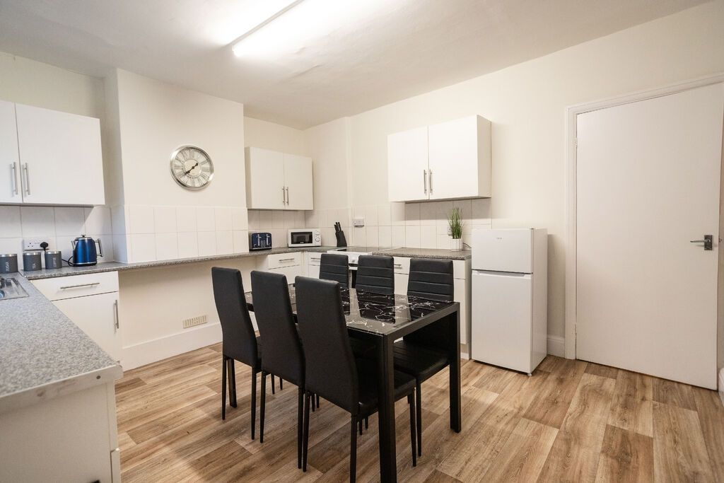 Property photo 3 of 14 Bright, Modern Kitchen With White Cabinetry, Integ...