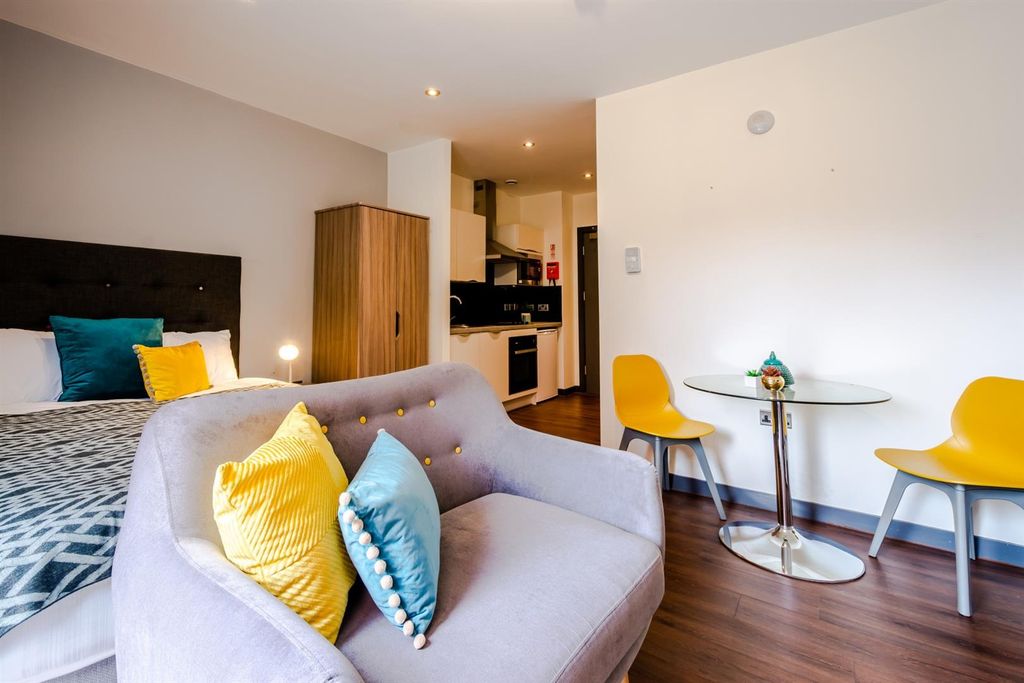 Property photo 2 of 3 Modern Studio With Vibrant Decor And Dining Area...