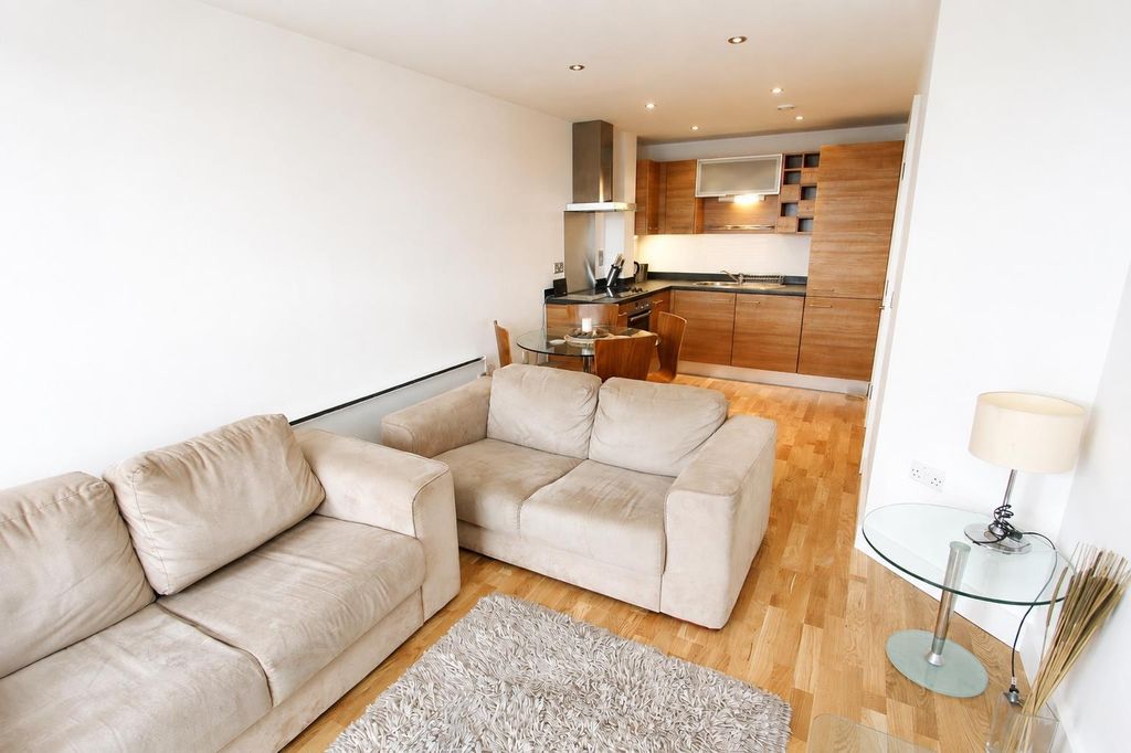 Property photo 2 of 6 Bright Open-Plan Living Area With Cozy Sofas...