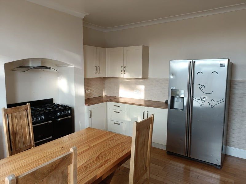 Property photo 3 of 8 Bright And Welcoming Kitchen Featuring Modern Whit...