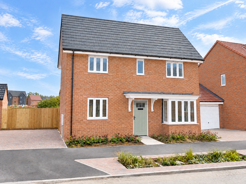 Property photo 1 of 9 A Modern Two-Story Red Brick House With A Grey Roof And Sage Green Door Stands Before A Bright Blue