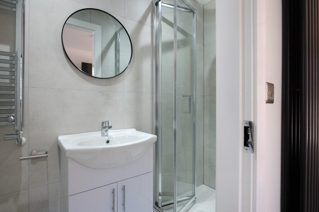 Property photo 3 of 15 Modern Bathroom With A Corner Glass Shower Enclosu...