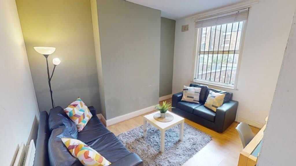 Property photo 1 of 8 A Cozy Living Room Featuring Comfortable Seating A...