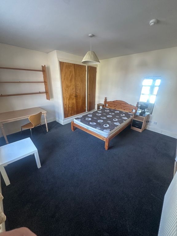 Property photo 2 of 8 Spacious Bedroom With Ample Desk And Storage...