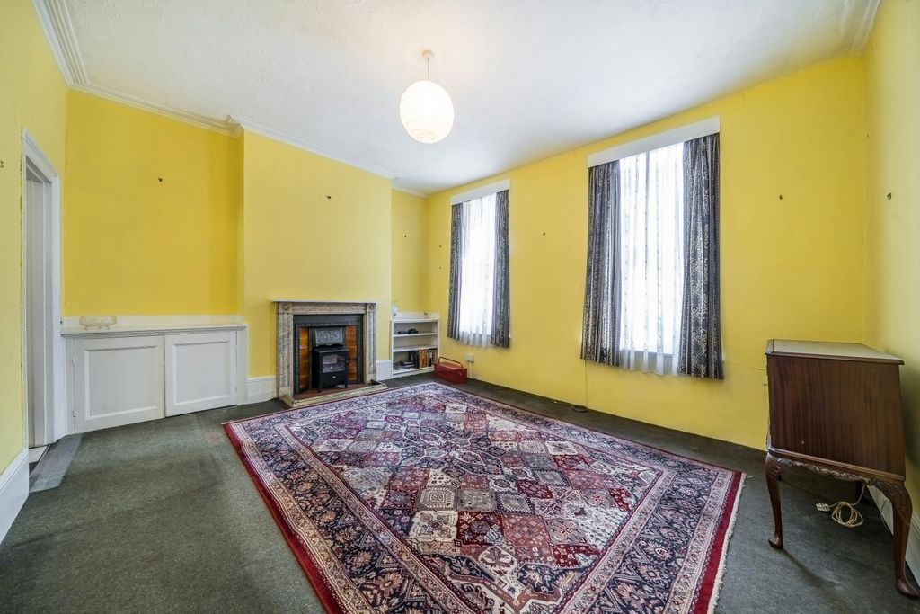 Property photo 3 of 16 255 Grays Inn Road  Bright Living Room With Fireplace And Large Windows.Jpg
