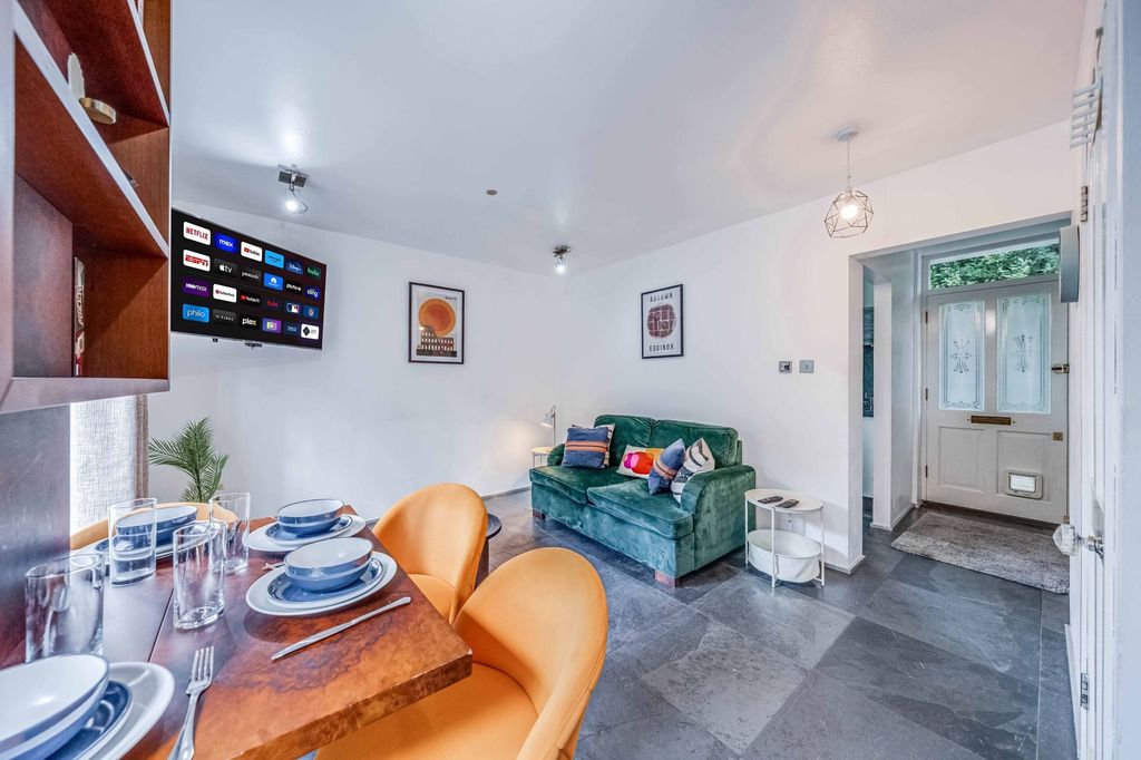 Property photo 2 of 19 Bright And Inviting Living Room Featuring A Comfor...