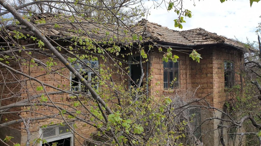Property photo 1 of 58 Exterior View Of An Old Brick House With A Tiled Roof Surrounded By Leafing Trees