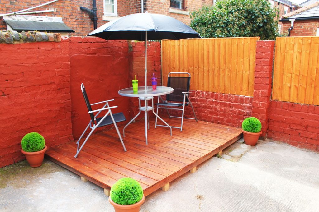 Property photo 2 of 8 A Charming Garden Area Featuring A Cozy Seating Ar...