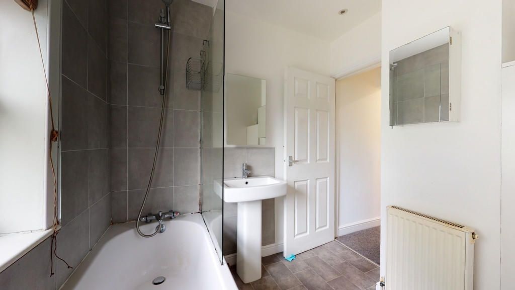 Property photo 2 of 14 Bright And Modern Bathroom Suite Featuring A Full-...