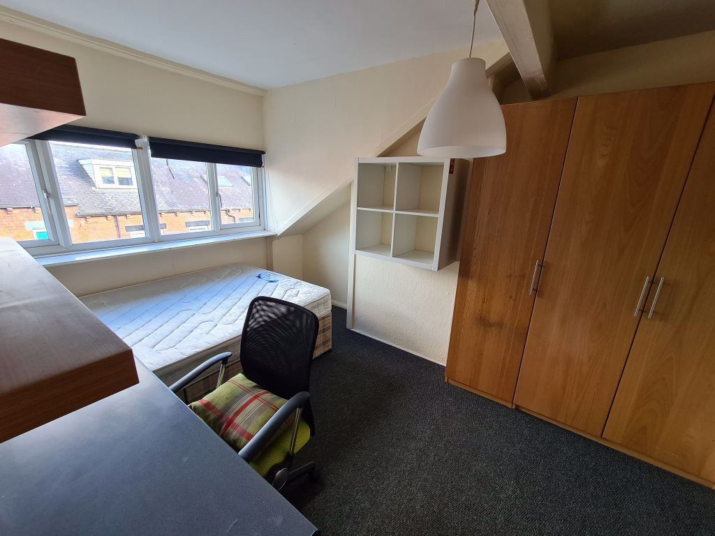 Property photo 2 of 17 A Cozy Single Bedroom Featuring A Large Window Tha...