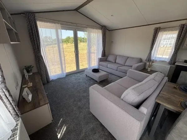 Property photo 2 of 17 Bright Lounge With Freestanding Sofas And Full Height Patio Doors